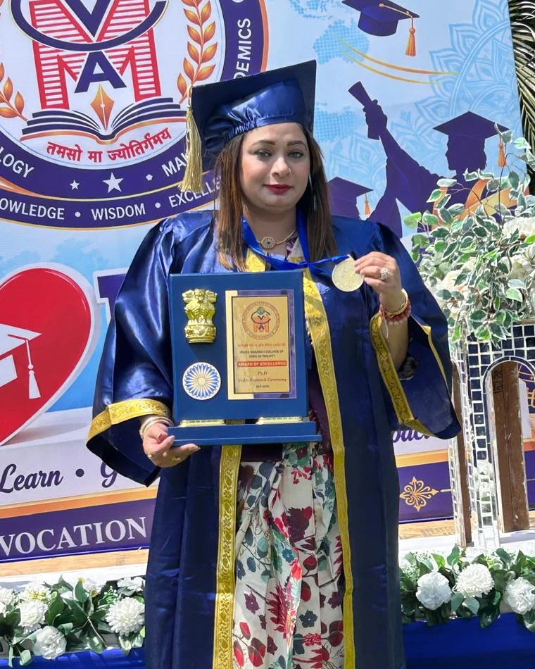 Dr. Dhhara Sooni in graduation gown with her Gold Medal and Award of Excellence